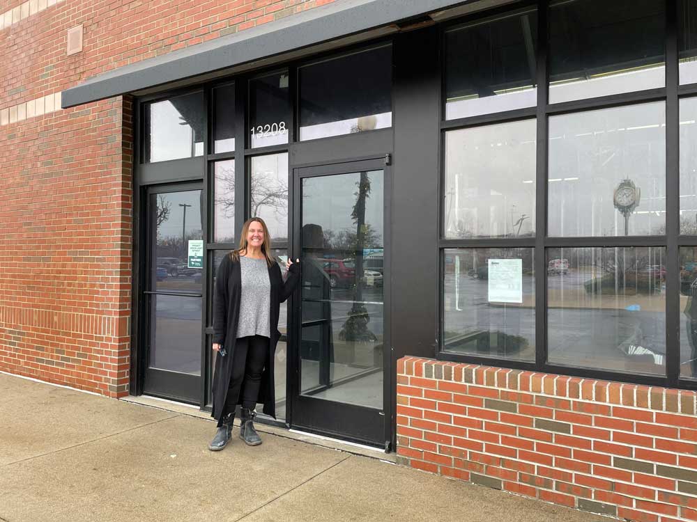 Founder and owner, Liz Blondy in front of the new Eastside Detroit location.